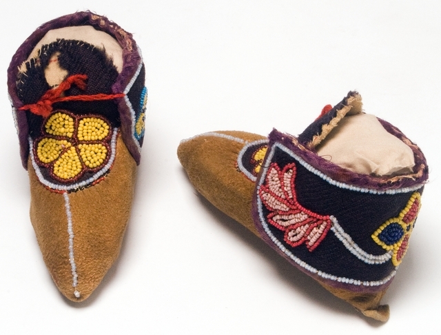 Pair of Ojibwe child's leather moccasins. Made in Isle, Mille Lacs County c.1910.