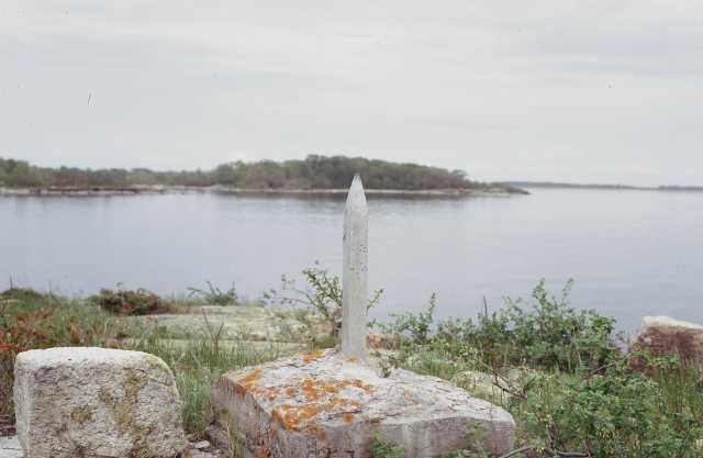 Color photograph of monument marking the northwest point of Lake of the Woods on Rose Island.