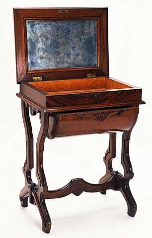 Color image of a Walnut sewing table used by Harriet Bishop. Created in 1850.