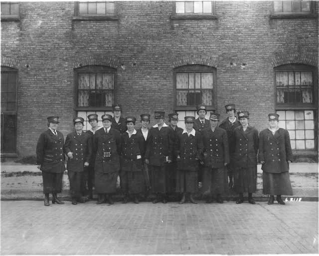 photograph of a group of uniformed streetcar conductresses