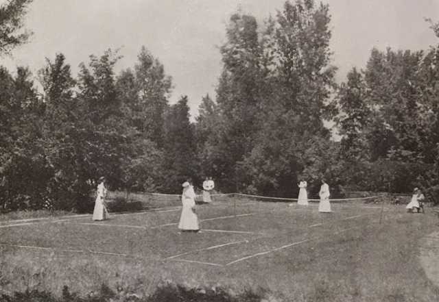 Black and white photograph of the Graham Hall tennis courts, ca. 1908.