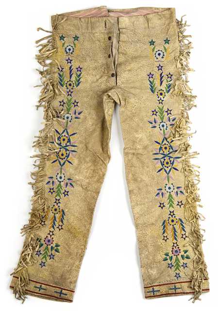 Color image of a pair of Lakota hide trousers with extensive bead and quillwork decoration. Made with a combination of machine and hand sewing. Collected at the Cheyenne River Indian Reservation, c.1900.