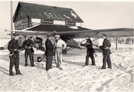 Black and white photograph of Elmer Sell and Minnesota Home Defense at Sell Airfield. 
