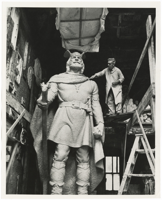 Sculptor John K. Daniels working on his statue of Leif Ericson