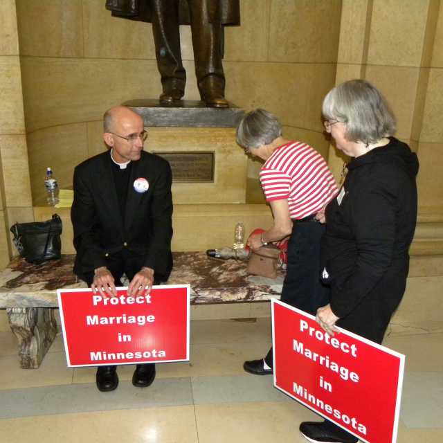 Color image of Demonstrators gather at the State Capitol in St. Paul to show their support of Minnesota Amendment 1. Photographed on May 20, 2011, by Flickr user Tom Morris.