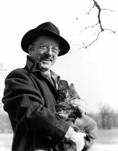 Charles Biederman with a cat