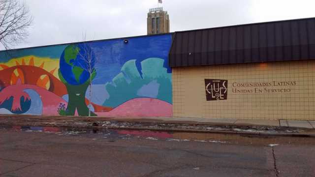 Color image of the exterior of the Minneapolis location of Comunidades Latinas Unidas en Servicio (CLUES), a nonprofit social service organization for Latinos, at 720 East Lake Street in Minneapolis, February 20, 2016. Photographed by Lizzie Ehrenhalt.