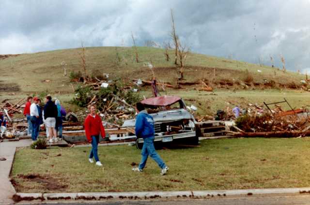 Survivors inspect property damage in Chandler after the Chandler–Lake Wilson Tornado, June 1992.