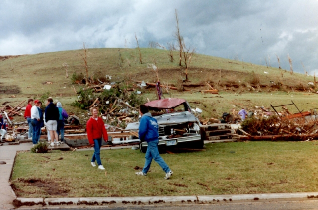 Survivors inspect property damage in Chandler after the Chandler–Lake Wilson Tornado, June 1992.