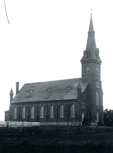 Black and white photograph of St. John the Baptist Catholic Church in Meire Grove, 1887.