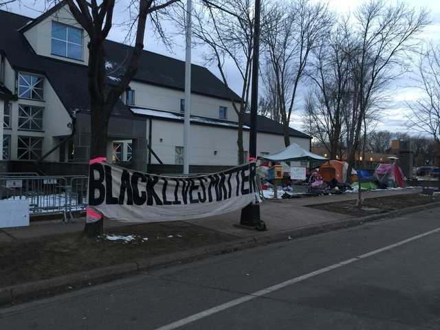 Black Lives Matter signs erected to protest the shooting of Jamar Clark on Plymouth Avenue in Near North Minneapolis (Fourth Precinct), November 2015. Photo by Rebecca Wright Gillette.