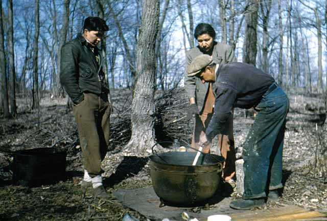 Maude Kegg (center) and family boiling maple sap