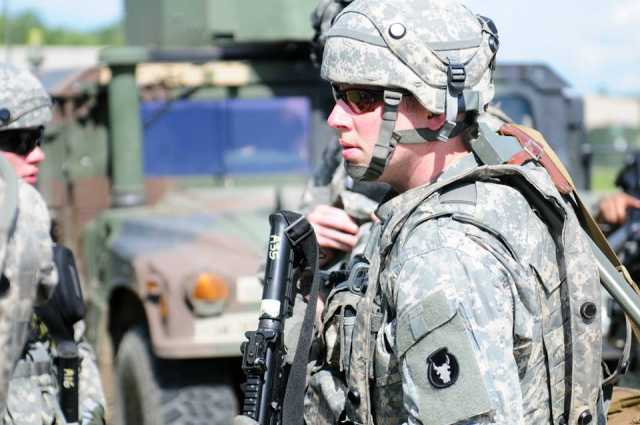 Color image of a combat training exercise at Camp Ripley, June 2015.