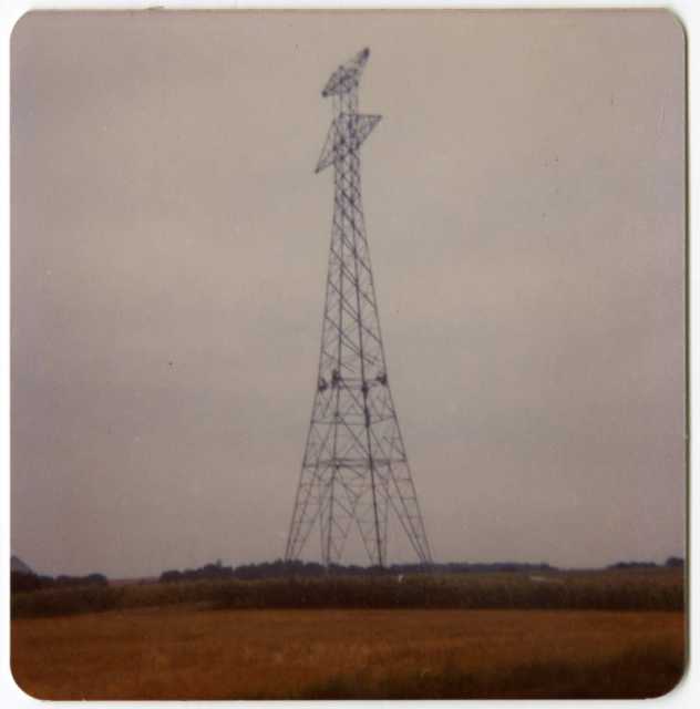 Workers finish connecting the upper and lower portions of a high-voltage power-line tower in Grant County, Minnesota, 1976–1978.
