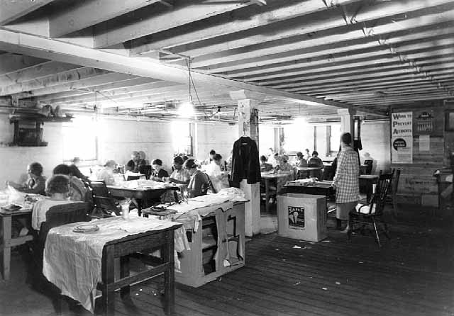 Black and white photograph of a sewing class at Northeast Neighborhood House, 1936. 