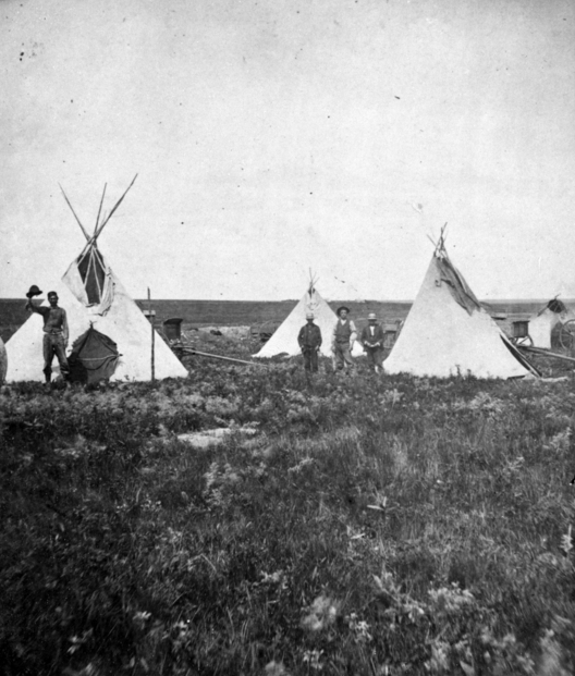 Black and white photograph of a temporary camp at Pipestone Quarry, ca. 1890s. Photograph by F.O. Pease.