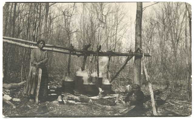 Ojibwe women making maple sugar at Cass Lake