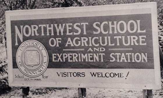 Black and white photograph of the entrance sign for the Northwest School of Agriculture and Northwest Experiment Station.  