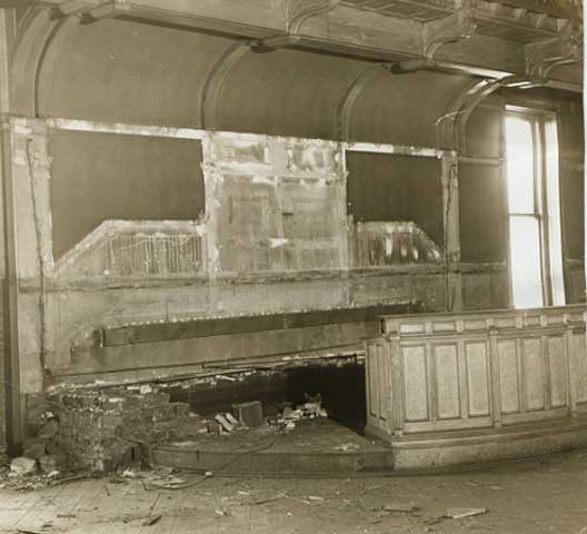 Black and white photograph of the Supreme Court chamber in the second capitol building, partially dismantled prior to building demolition, 1937. Photographed by the Minneapolis Tribune.