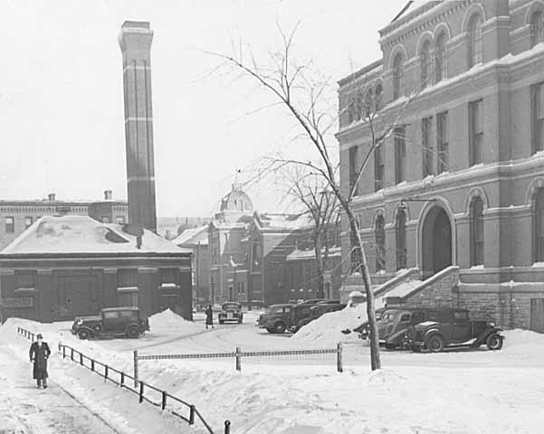 Black and white photograph of the second state capitol and powerhouse prior to demolition, 1937. Photographed by the St. Paul Dispatch.