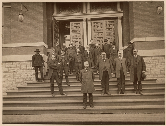 Minnesota state officers posed with Governor Lucius F. Hubbard