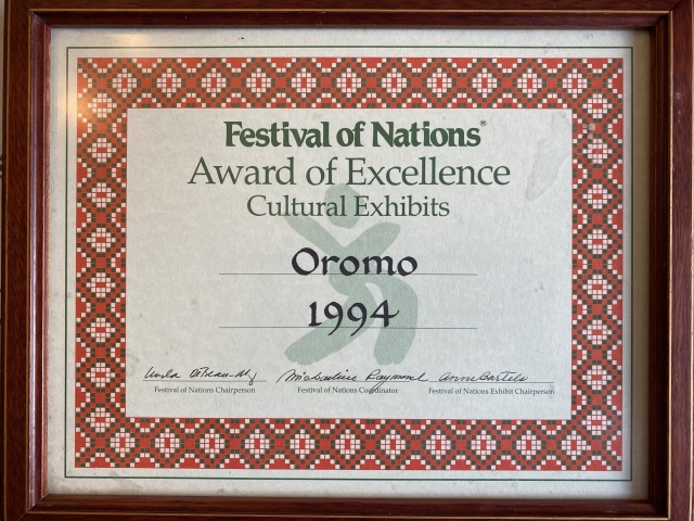 Award presented to the designers of a Oromo cultural exhibit at the Festival of Nations