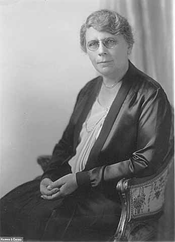 Black and white photograph of Frances Densmore seated, 1928.