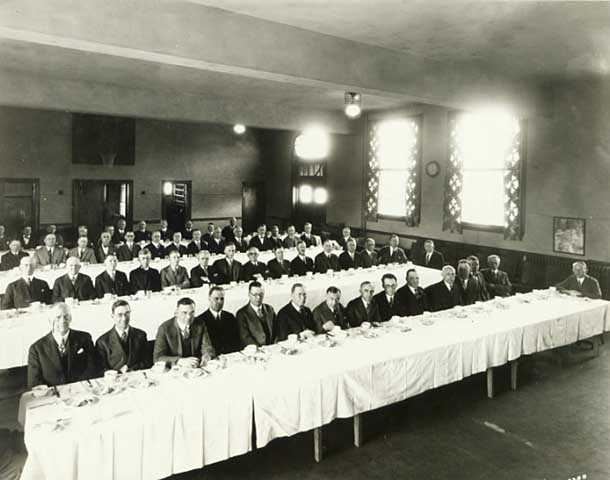 Black and white photograph of a Lions Club meeting at Northeast Neighborhood House, 1926. 