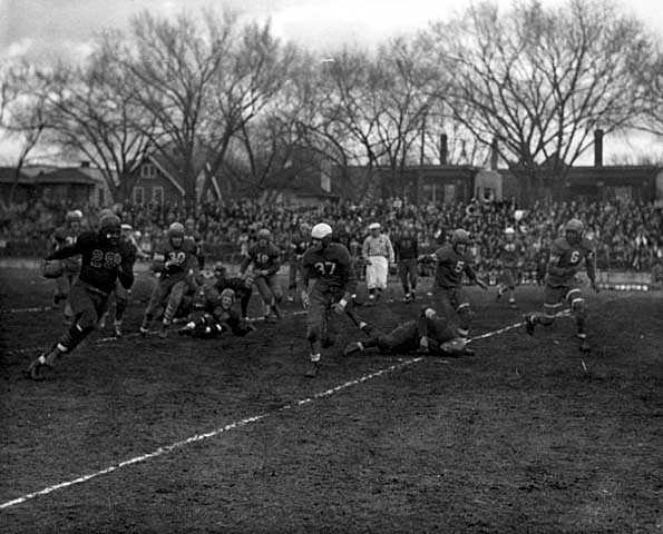 Black and white photograph of a football game at Phyllis Wheatley House, 1940. 