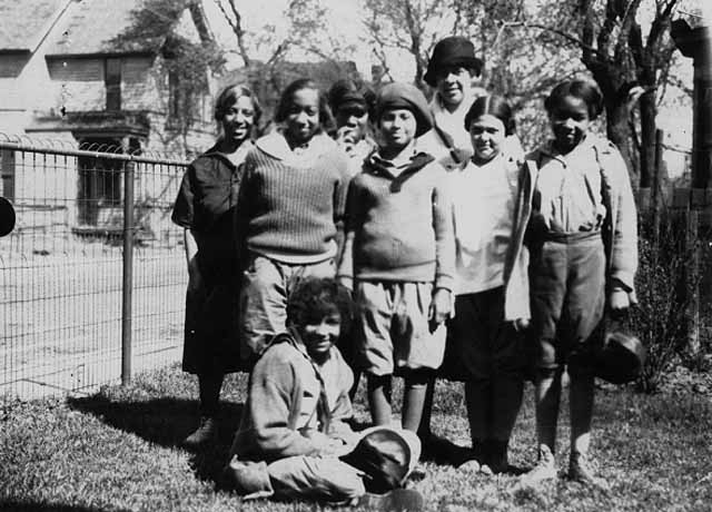 Black and white photograph of individuals starting a hike from Phyllis Wheatley House with Ethel Ray (later Ethel Ray Nance), 1926.