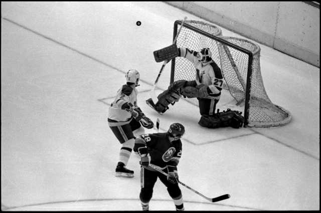 The Minnesota North Stars’ goalie Gilles Meloche defends a shot on goal by the Islanders’ Anders Kallum in a Stanley Cup finals game at the Met Center in 1981.