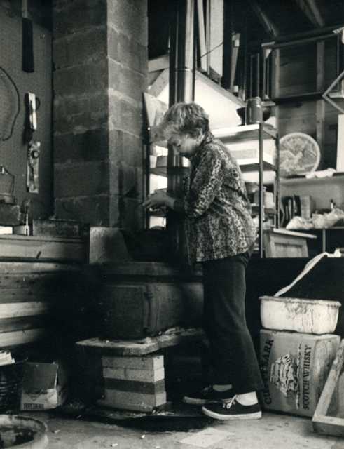 Gene Ritchie Monahan working at her kiln