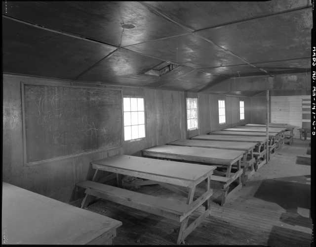 Classroom in the education building (Building 7), CCC Camp Rabideau F-50. Photo by Jerry  Mathiason, 1994. From box 1 (144.G.8.4F) of Historic American Buildings Survey records related to Minnesota structures, 1882-2001, 1883. Manuscripts Collection, Minnesota Historical Society, St. Paul.