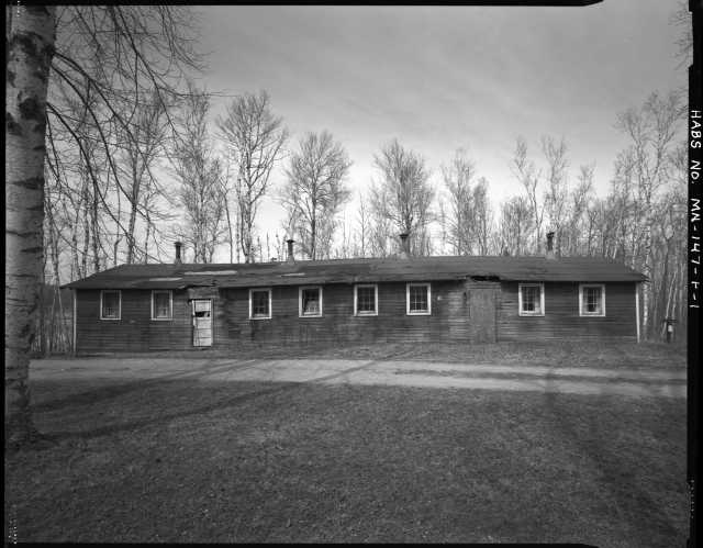 South (front) view of the recreation hall (Building 8), CCC Camp Rabideau F-50. Photo by Jerry Mathiason, 1994. From box 1 (144.G.8.4F) of Historic American Buildings Survey records related to Minnesota structures, 1882-2001, 1883. Manuscripts Collection, Minnesota Historical Society, St. Paul.