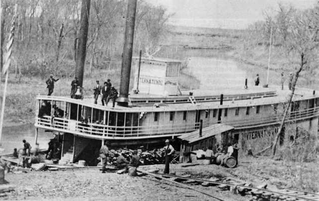 Black and white photograph of the International tied up at Moorhead,early 1870s.