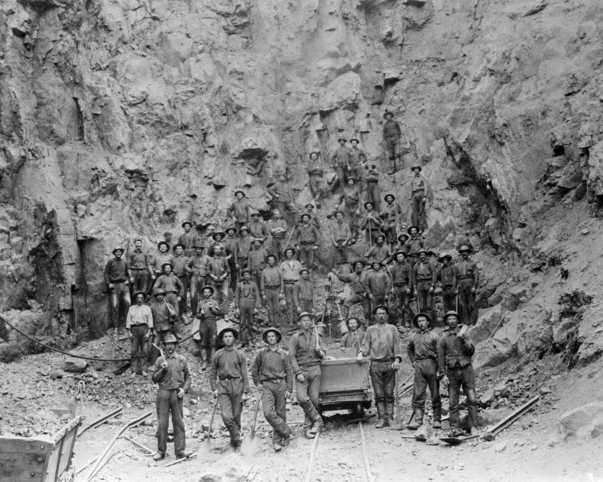 Black and white photograph of miners in the pit of the Tower-Soudan mine, 1890.