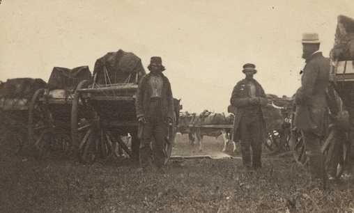 Black and white photograph of a camp with Red River carts, ca. 1860. 