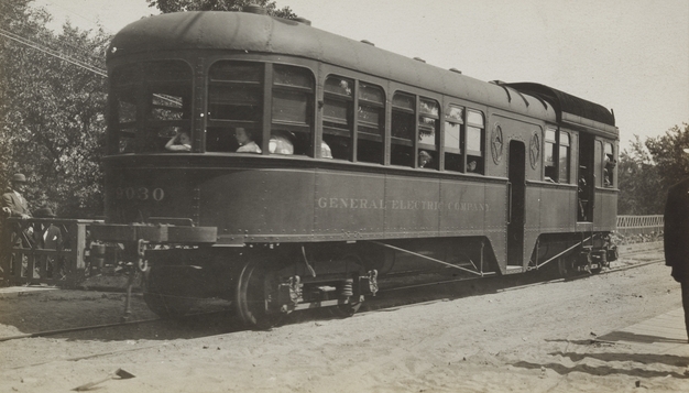 Black and white photograph of cars on Dan Patch line of Minneapolis, St. Paul, Rochester & Dubuque Traction Company, 1910. 