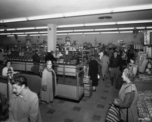 Black and white photograph of the interior of the Woolworth's store at Southdale shopping center on opening day in 1956. 