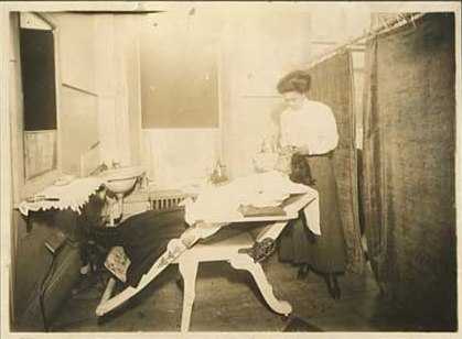 Photograph of Smith and a client at the Olive Hair Store, 1913.