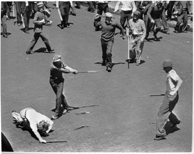 Men swinging bats and sticks during clash between striking truckers and a citizens’ army, Minneapolis, May 21, 1934. Pictured in the foreground are Basil Hurt, Merle Kerr, and Frank Vocks.