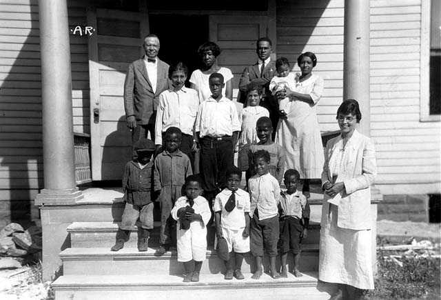 Black and white photograph of children on steps of Phyllis Wheatley House, ca. 1925.