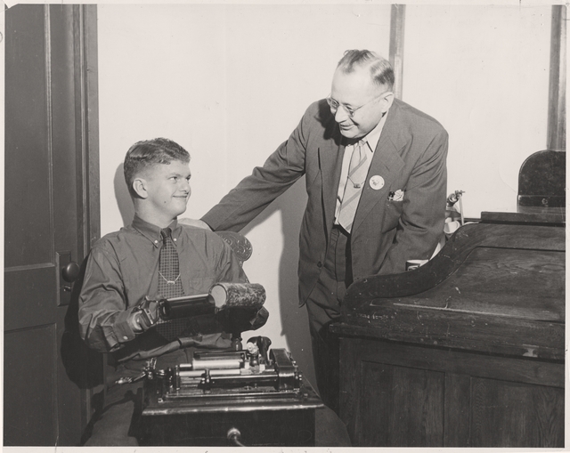 Black and white photograph of boy being trained at Artificial Limb Company Minneapolis, c.1930.