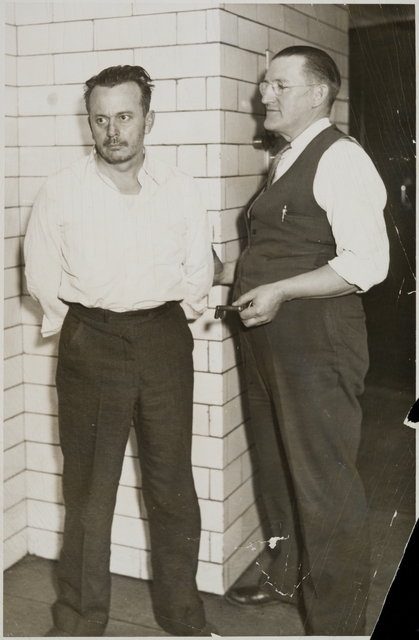 Arthur “Doc” Barker, left, with jailer, William Gates