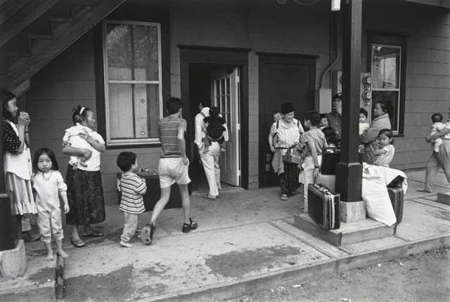 Black and white photograph of Hmong Families, Frogtown, 1994. Photograph by Wing Young Huie.
