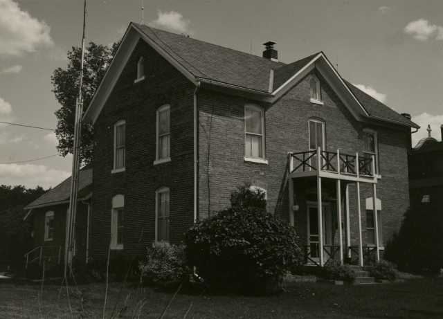 Black and white photograph of a brick house built by Henry Imdieke in Meire Grove in 1883.