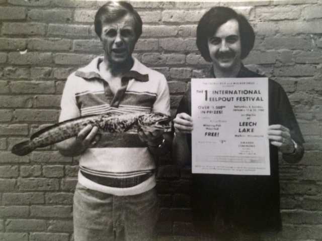 Ken Bresley (holding the eelpout) and Don Overcash, the founders of the International Eelpout Festival, promoting the first festival, 1980. Photo by Don Smith, Walker Pilot-Independent. Used with permission.
