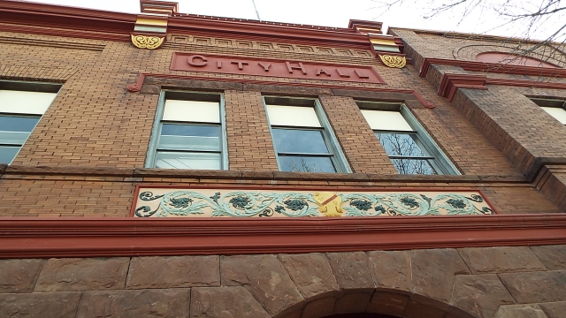 Color image of Sullivanesque floral designs outside city hall, 2016.