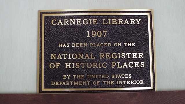 Color image of the sign on Carnegie Building, 120 North Ash Street, designed by Bert Keck, 2016.