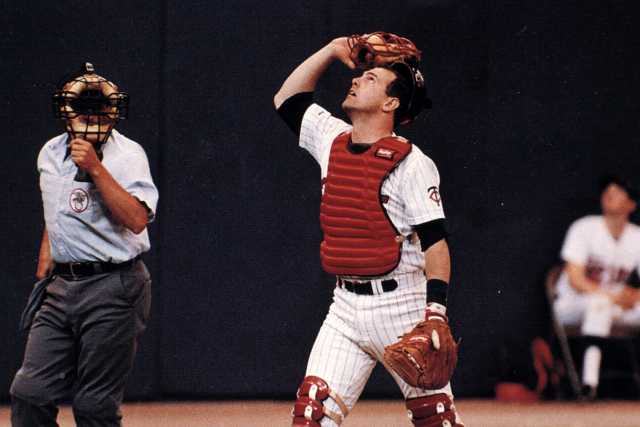Twins' catcher Tim Laudner watches a foul ball fly out of reach, and into the Metrodome seats.